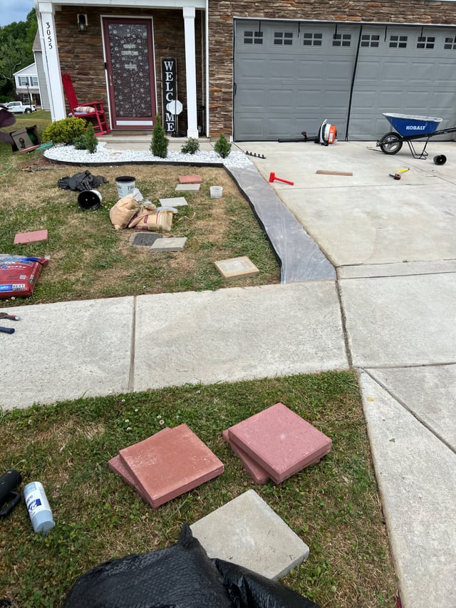 Front garden bed being edged with pavers